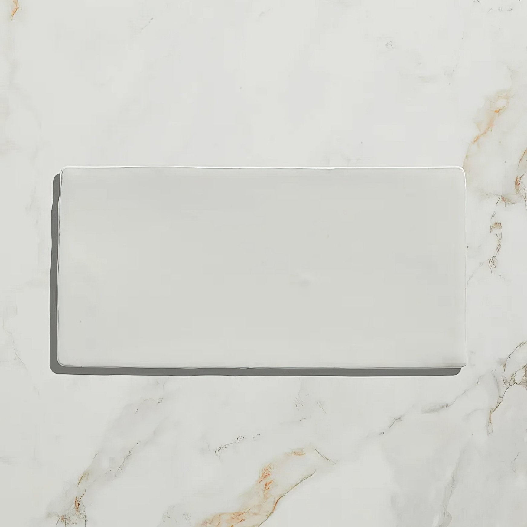 A sleek rectangular white ceramic tile with a glossy finish for Seaton Ceramic Ice Cream product display