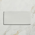A sleek rectangular white ceramic tile with a glossy finish for Seaton Ceramic Ice Cream product display