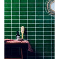 Dark green rectangular ceramic seaton sea grass tiles with white grout lines in a grid pattern