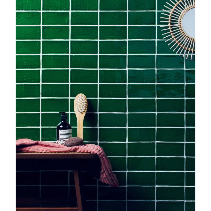 Dark green rectangular ceramic seaton sea grass tiles with white grout lines in a grid pattern