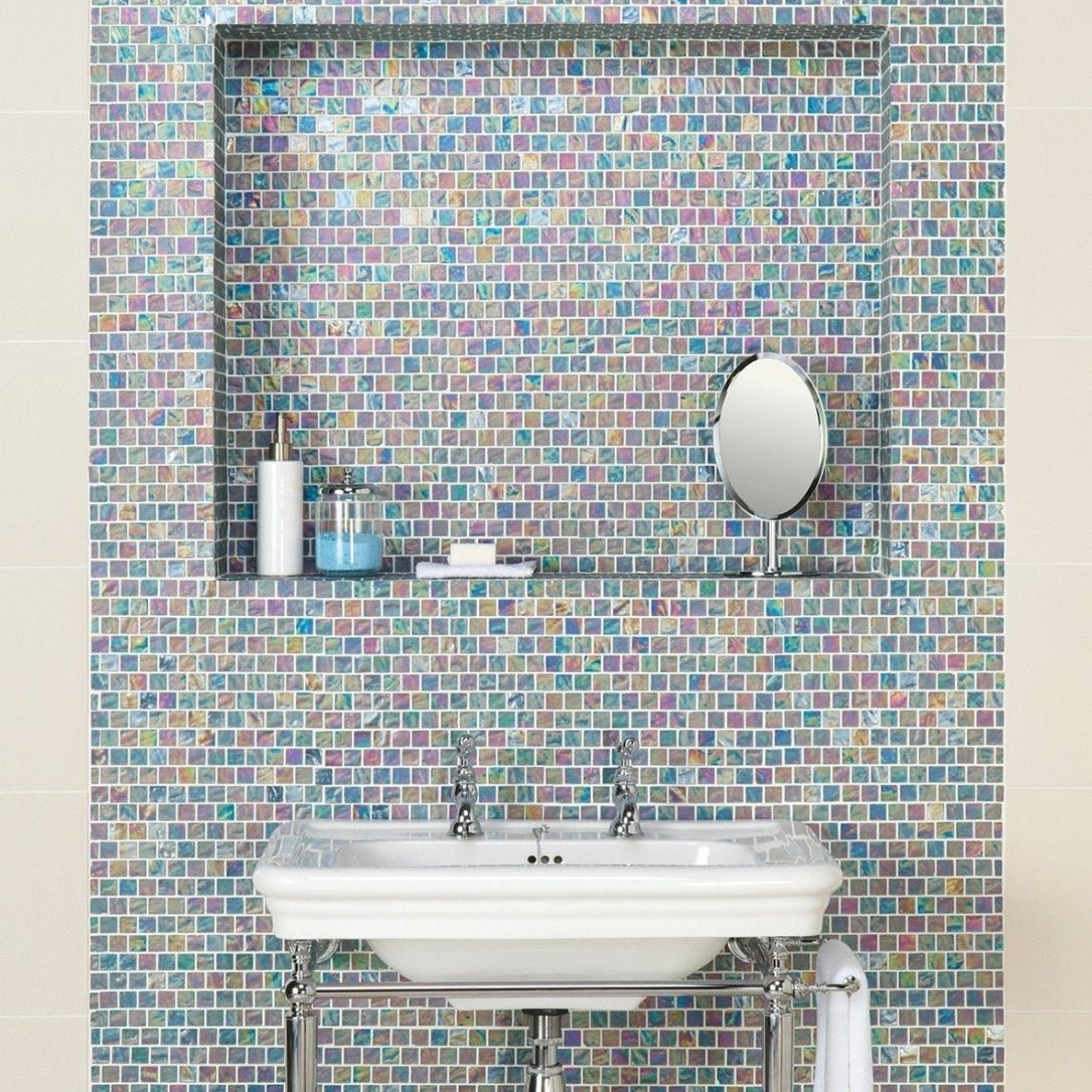 Serene Therapy Glass Mosaic iridescent green and purple glass mosaic with a white sink and towel rack