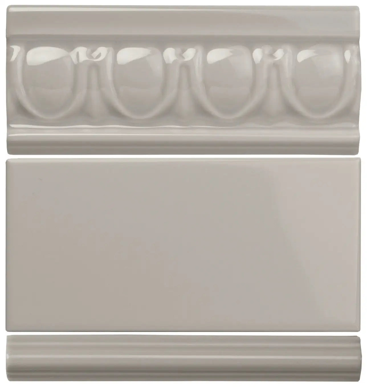 Set of three gray ceramic tiles featuring a decorative molded border tile, a plain rectangular wall tile, and a simple baseboard tile.