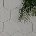 Shadow white field porcelain white hexagonal tiles with thin black grout lines for stylish flooring or walls