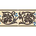 Cream-colored ceramic tile border with bold black vine and leaf patterns accented by small blue dots shaftesbury 2 brown on white