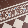 Shaftesbury 2 tile border brown on white decorative ceramic tiles with intricate leaf patterns and blue accents
