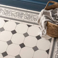 White and gray shaftesbury 2 tile border on dover white floor with hexagonal shapes and decorative leaf motifs