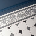 Gray and white shaftesbury 2 tile border with intricate leaf patterns on dover white background for decorative use