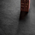 A miniature red brick house model with gold-trimmed windows and a circular roof detail in shale black 30 x 60cm