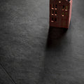 A miniature red brick house model with detailed windows and textured surface showcasing shale black 60 x 120cm tile
