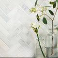 White marble herringbone tile backsplash featuring East Hampton Shelter Island marble mosaic design