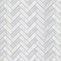 White marble tiles in a herringbone pattern from east hampton shelter island marble mosaic collection