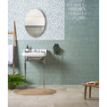 White ceramic Shoreline pedestal sink with chrome legs designed for modern bathroom use