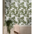 White ceramic tiles with a repeating pattern of dark green fern leaves from silk screen ceramic fernery collection