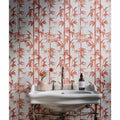 White ceramic sink with chrome fixtures and ornate metal legs from silk screen ceramic lantau bamboo incardine collection