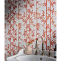 A sleek curved chrome faucet with ornate handles on a white sink for the silk screen ceramic lantau bamboo incardine