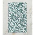 A rectangular silk screen ceramic tile featuring an intricate repeating pattern of green leaves on a white background