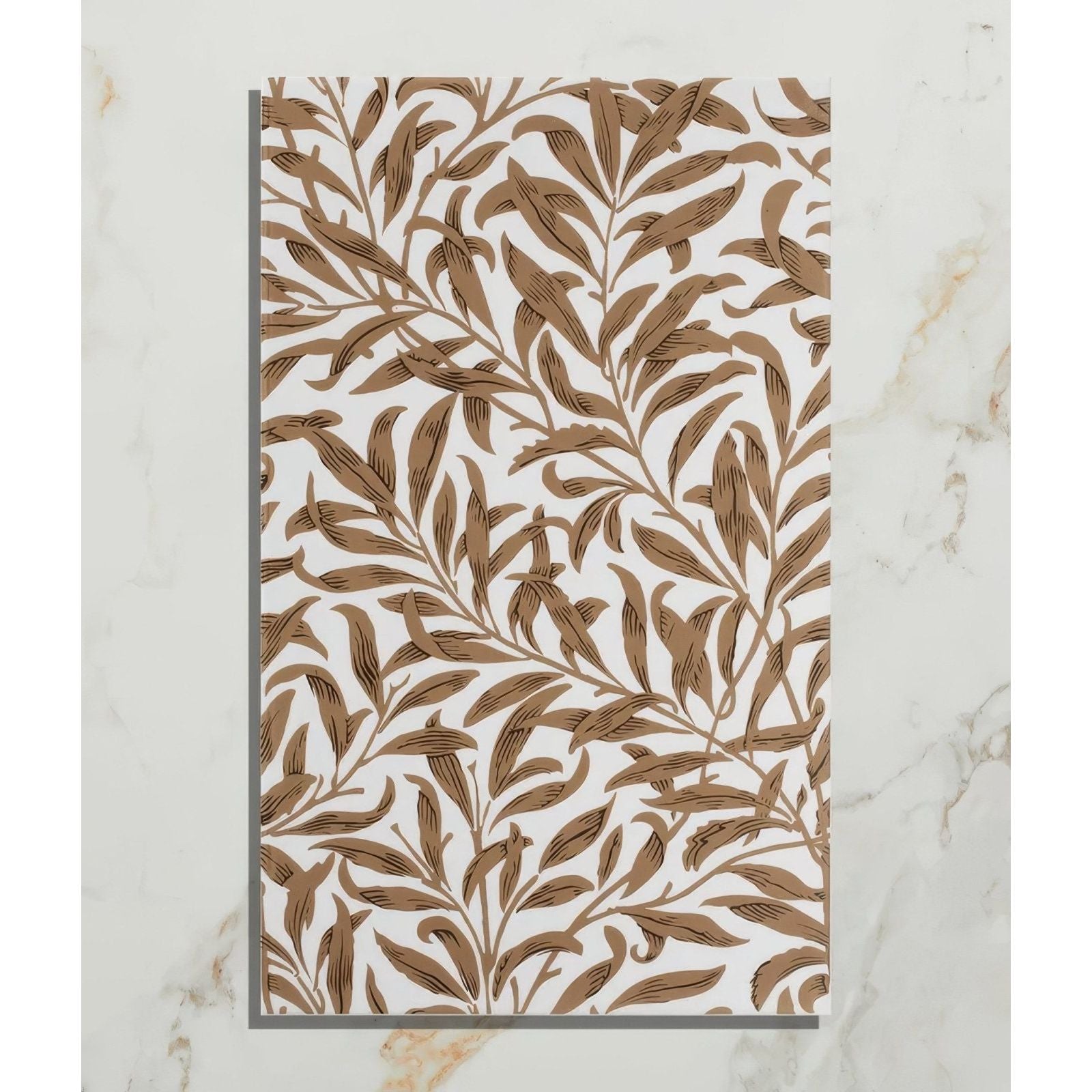 A rectangular white ceramic tile with an intricate brown leafy vine pattern from silk screen ceramic willow cottage tobacco