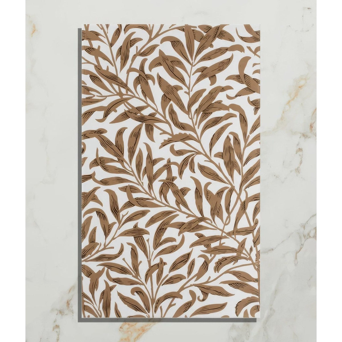 A rectangular white ceramic tile with an intricate brown leafy vine pattern from silk screen ceramic willow cottage tobacco