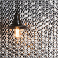 Silver Link Aluminium Mosaic silver hexagonal aluminium mosaic with a black vintage pendant light