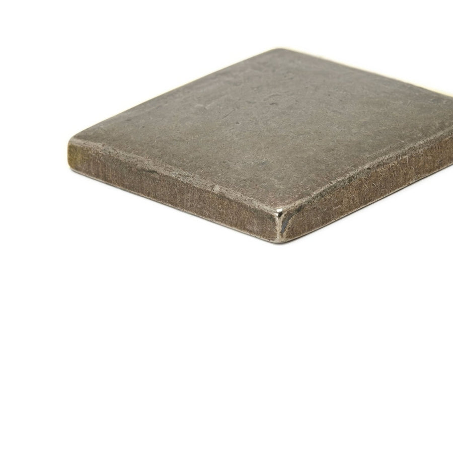 Small foundry cabochon inset square metal tile with matte finish textured surface and rounded edges