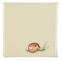 Cream-colored square ceramic tile with hand-painted snail featuring a brown shell and green antennae titled snail on off white