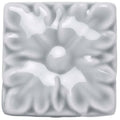 A square glossy white ceramic tile with a raised floral design from snape knightsbridge collection
