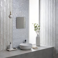Solinda Mixed Format Mosaic silver glass mosaic with a white ceramic vase of greenery
