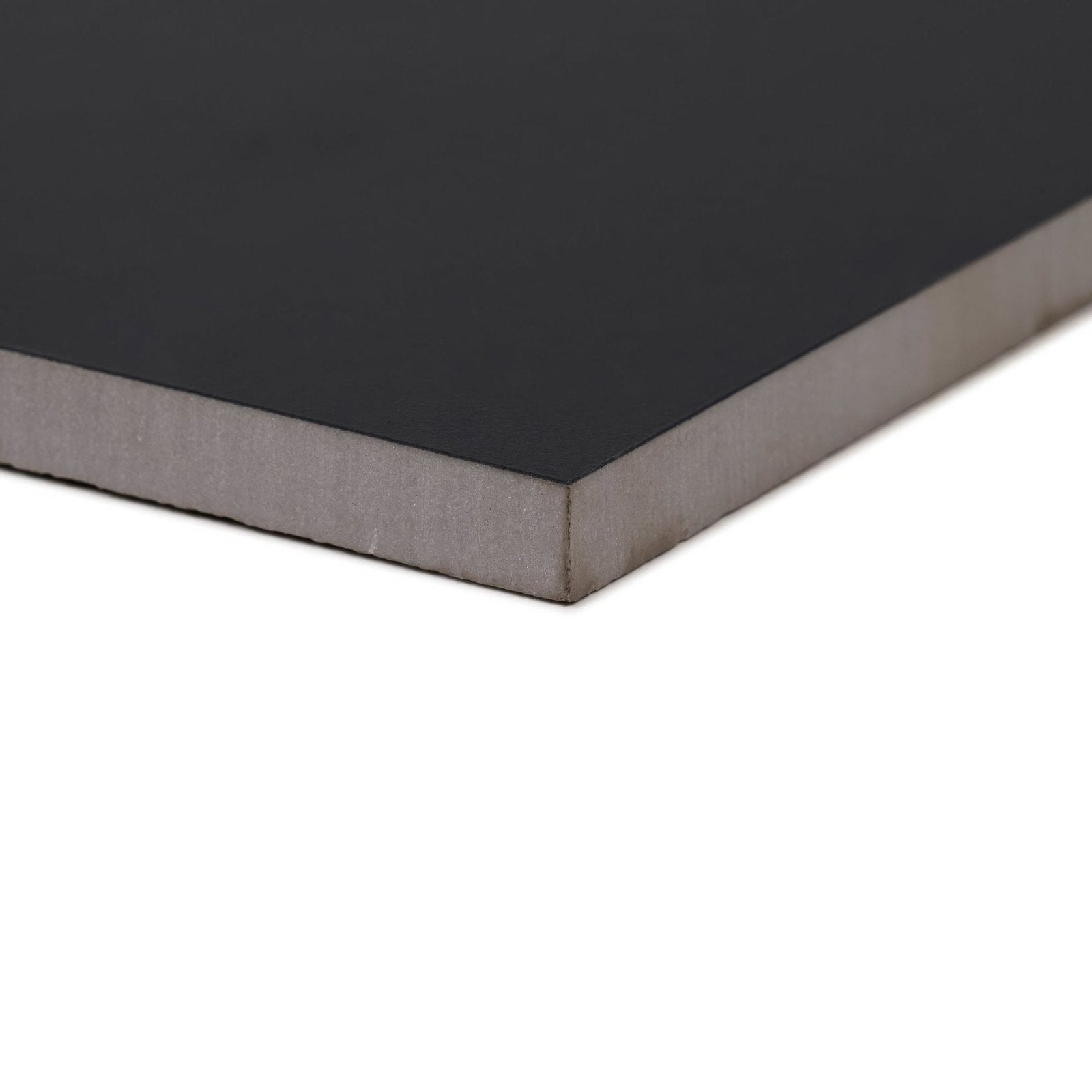 Black matte-finished foam board with gray textured edge shown on back side of sorrento black porcelain tile product
