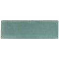 A rectangular matte-finished teal ceramic tile with subtle tone variations and textured surface south cliff sage brick tile
