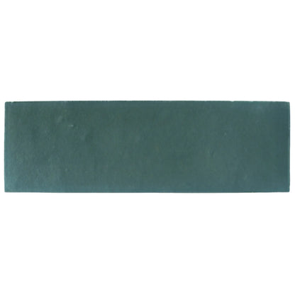 A rectangular matte teal ceramic tile with subtle texture from south cliff brick tile collection