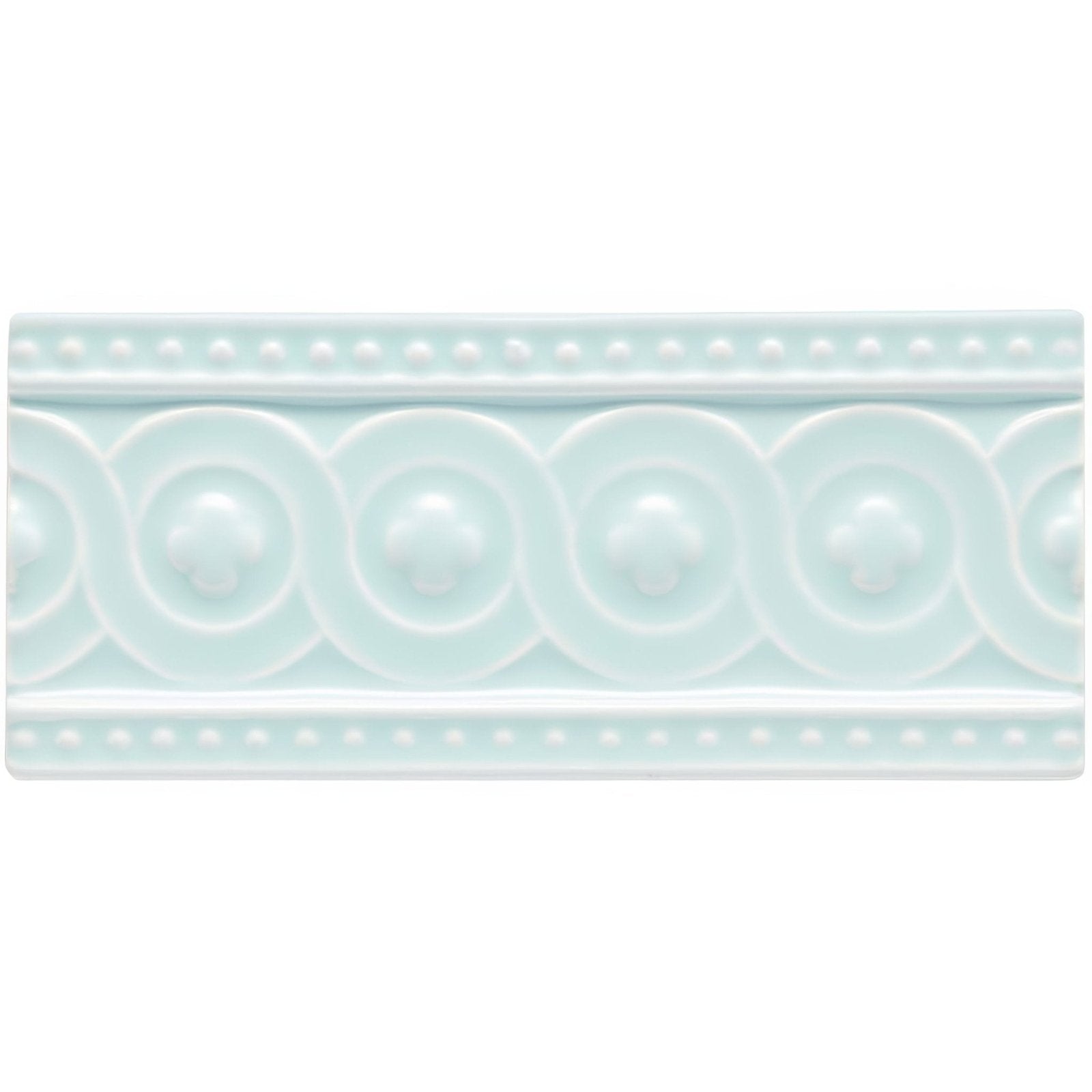 A rectangular light mint-green ceramic tile southwold baroque with raised decorative border and circular motifs