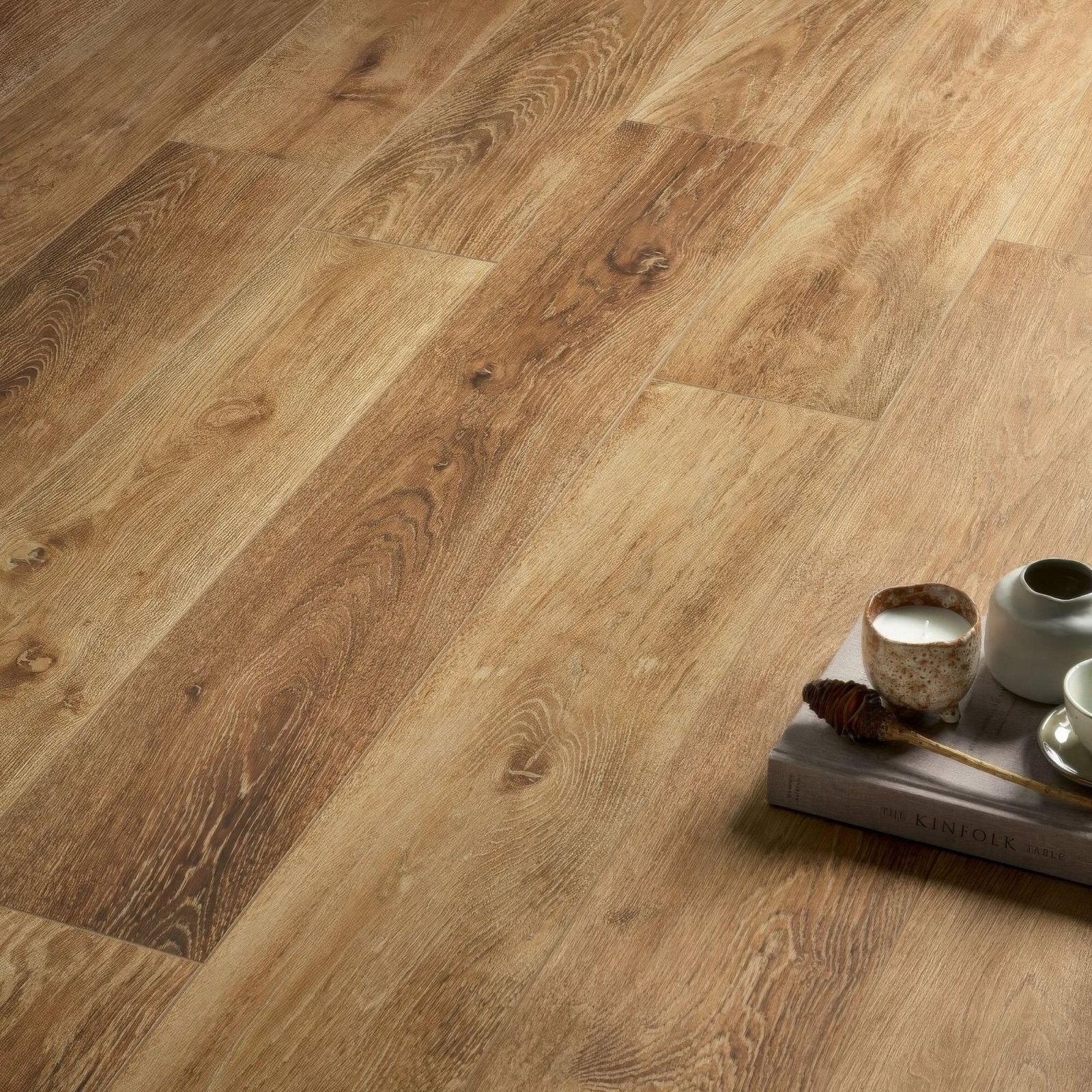 Southwold oak plank warm-toned wood-grain laminate flooring with a natural finish for durable interior use