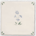 Cream-colored ceramic tile spring alice 13 x 13cm with delicate hand-painted floral design in blue and green hues