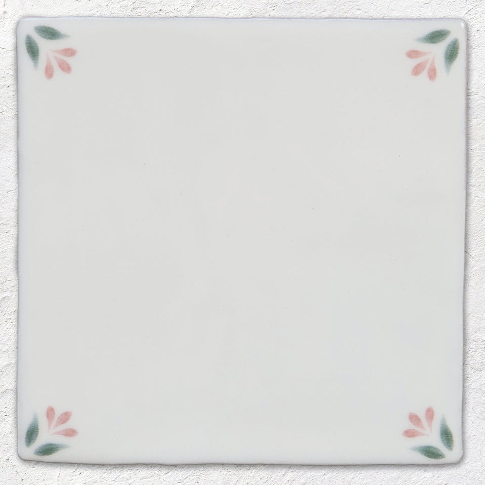 White ceramic tile spring april blush 13 x 13cm with delicate pink and green floral motifs at each corner