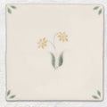 Spring elsie 13 x 13cm cream ceramic tile with hand-painted yellow flowers green leaves and corner leaf motifs