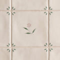 Cream-colored ceramic spring lucie 13 x 13cm tiles with delicate hand-painted soft pink and green floral motifs