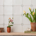 Spring May 13 x 13cm white ceramic tile with green leaf motifs