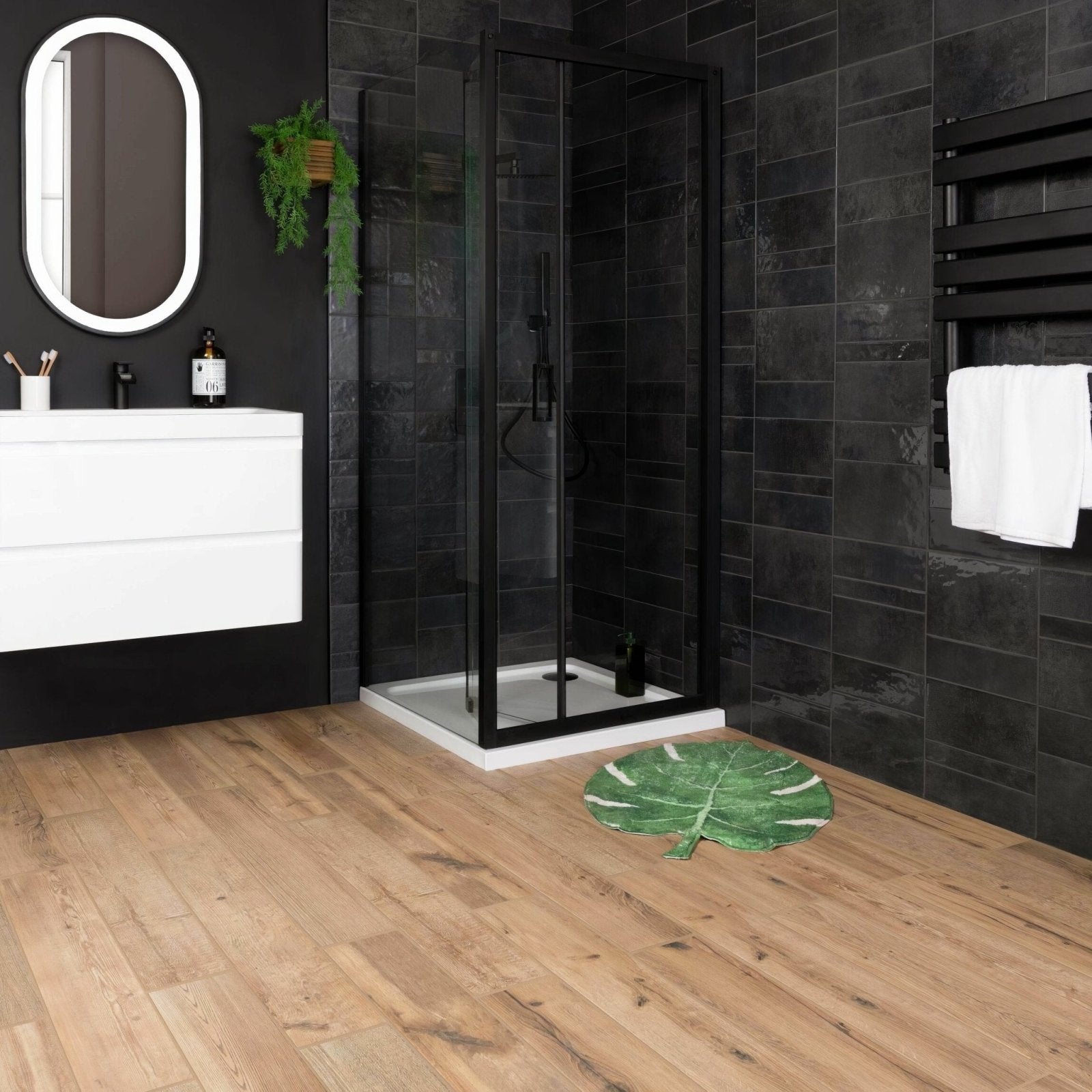 Green leaf-shaped bath mat with white veining pattern from springwood honey tiles featuring soft textured fabric