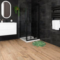 Green leaf-shaped bath mat with white veining pattern from springwood honey tiles featuring soft textured fabric