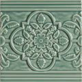 A glossy sage green ceramic tile st james on jade breeze with intricate raised floral and leaf pattern in quatrefoil design