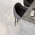 Statuarietto Honed 60x60cm white marble-effect tiles with a black bar stool
