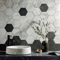 Statuarietto Honed Hexagon Mosaic white marble hexagonal mosaic with a white vessel sink and black tap