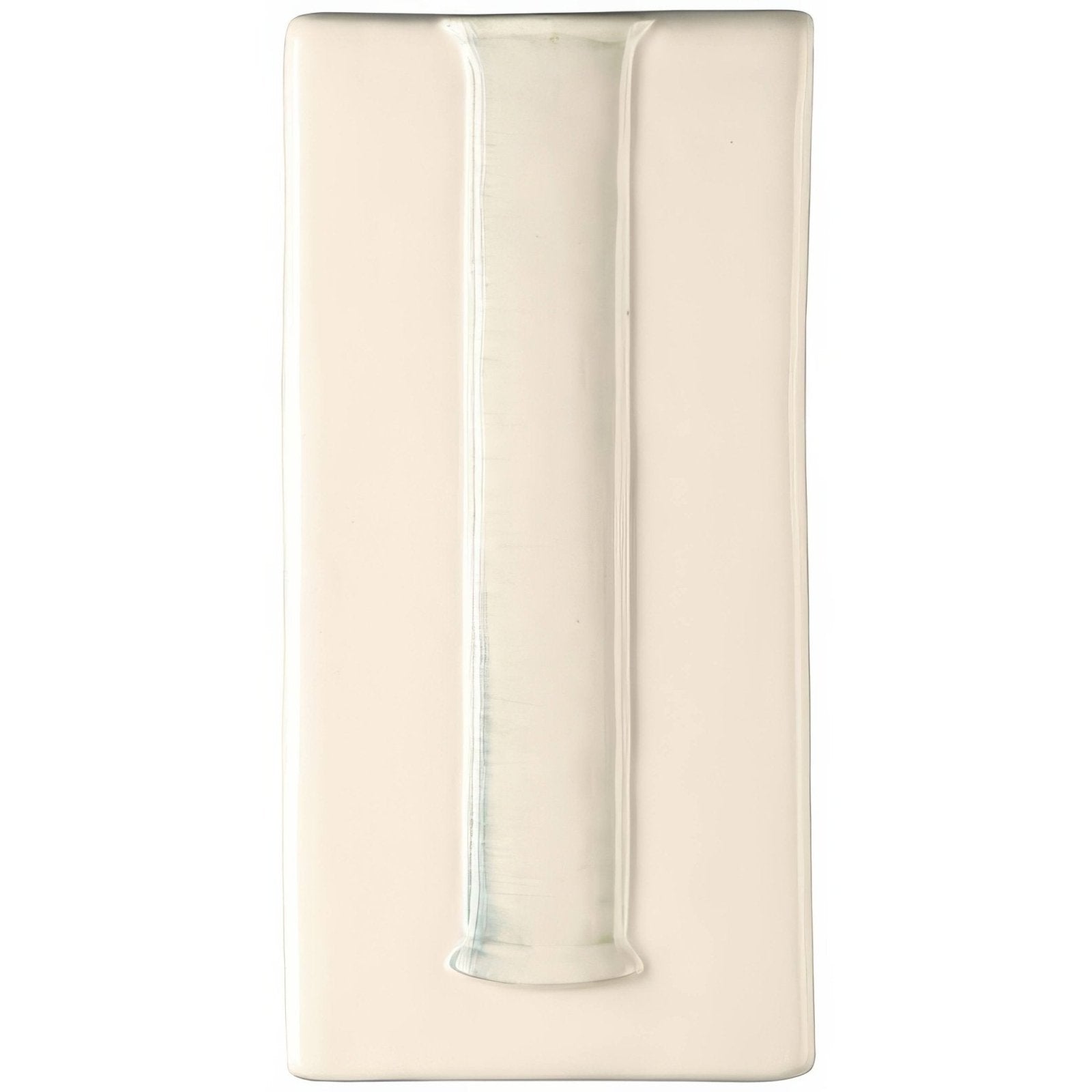 Cream-colored ceramic stem vase with central vertical groove and subtle glossy finish wall-mounted on off white