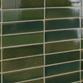 Dark green rectangular stone glaze ceramic british green gloss brick tiles with a glossy finish arranged in a grid pattern