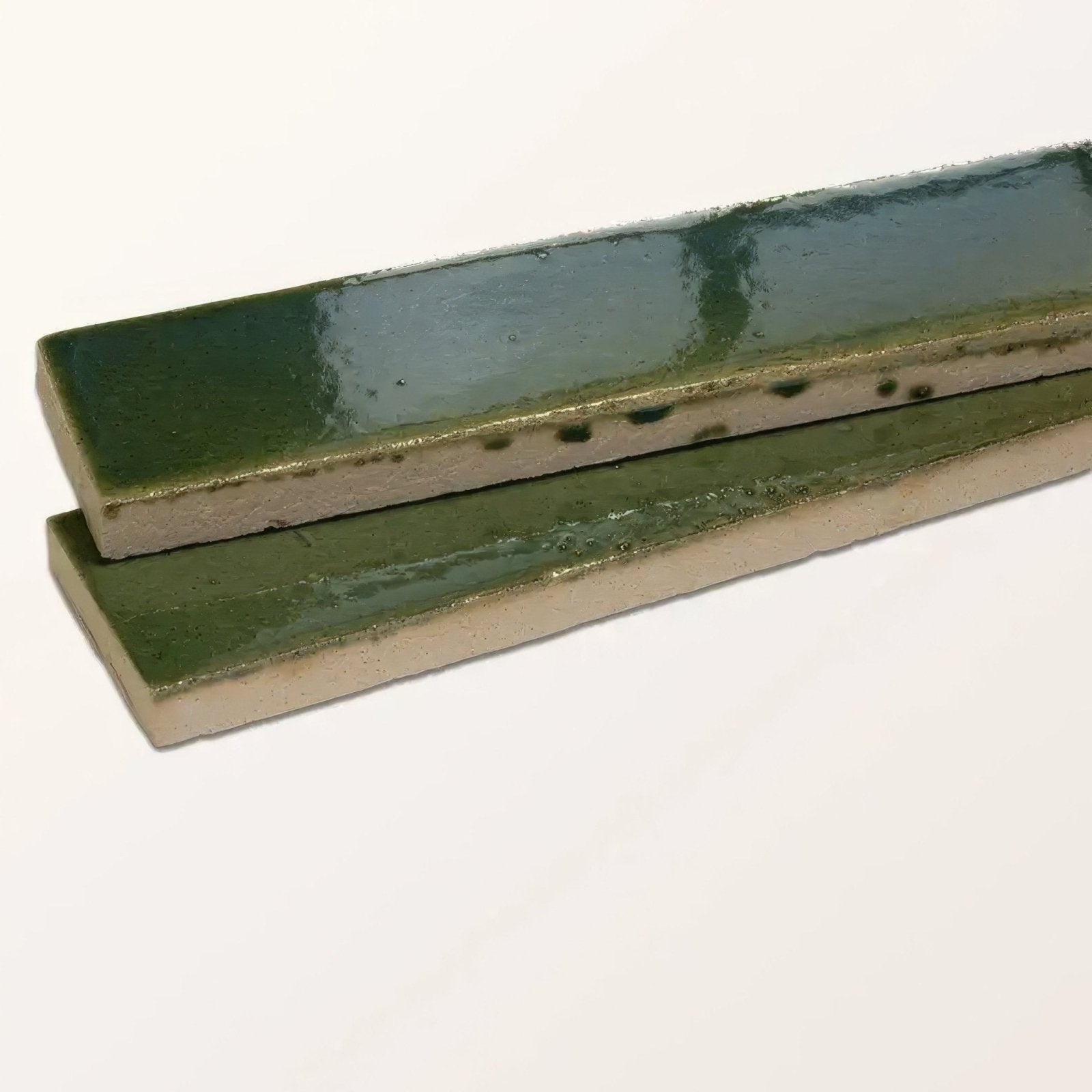 Two stone glaze ceramic british green gloss brick tiles with glossy muted green glaze and speckled edges