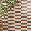 Brown and cream rectangular stone glaze ceramic chalkstone gloss brick tiles arranged in a staggered pattern
