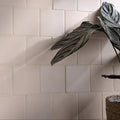White square ceramic tiles with a subtle matte finish arranged in a classic subway pattern stone glaze ceramic chalkstone matt square