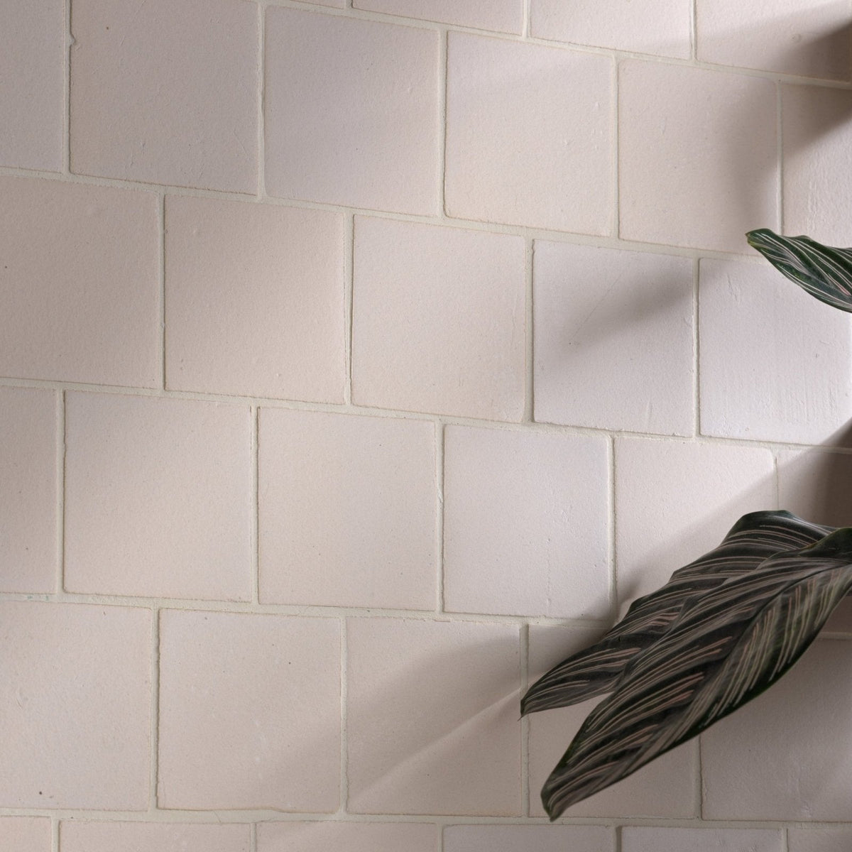 White rectangular stone glaze ceramic chalkstone matt square tiles with subtle texture and clean grout lines
