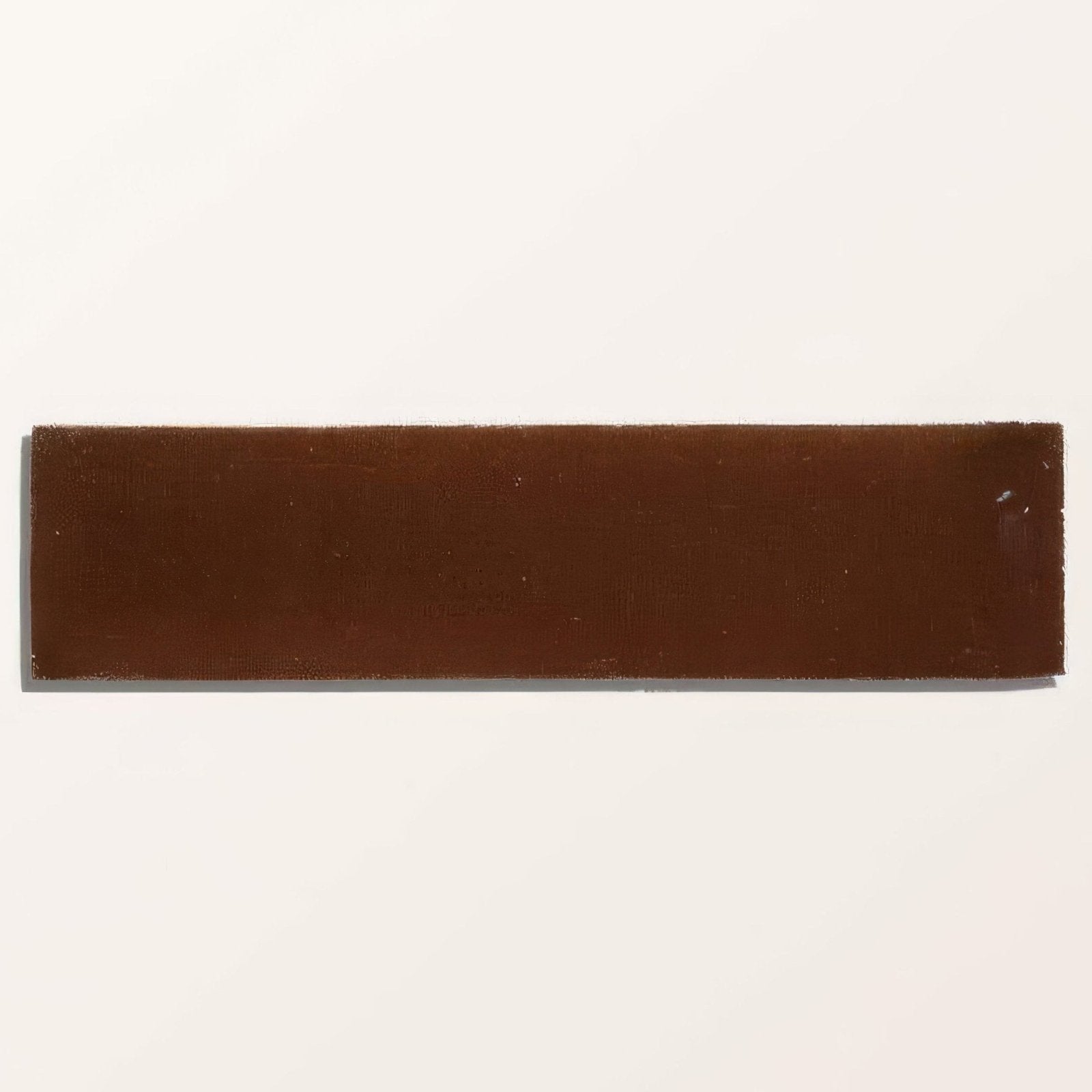 A rectangular brown stone glaze ceramic tile with a smooth, slightly glossy finish and subtle texture cola gloss brick