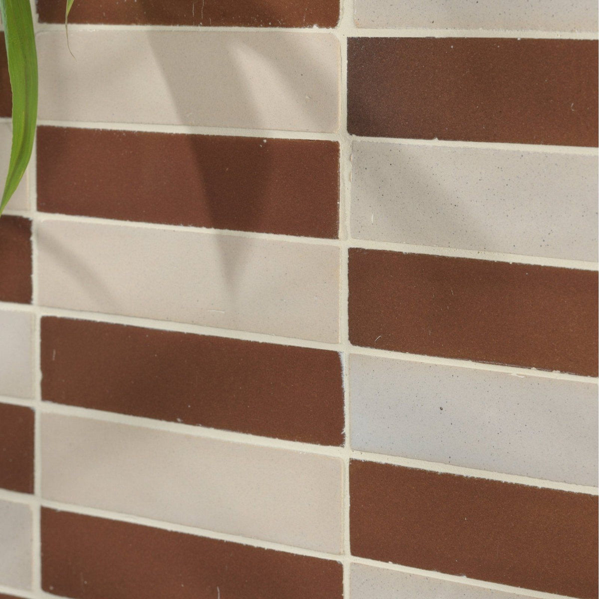 Stone glaze ceramic cola gloss brick subway tiles in brown and white rectangular shapes arranged in a staggered pattern